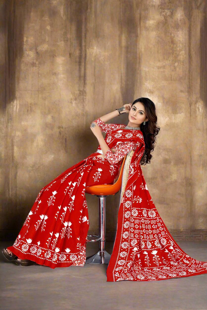 Fancy red Batik print cotton saree with unique design, ideal for wedding events.