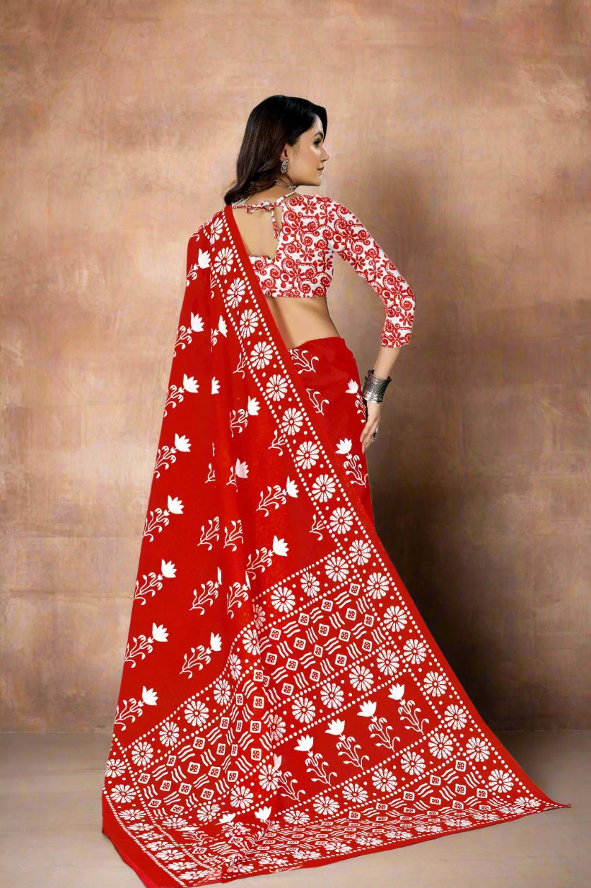 Elegant red Batik print saree made of soft cotton, ideal for Indian wedding celebrations.