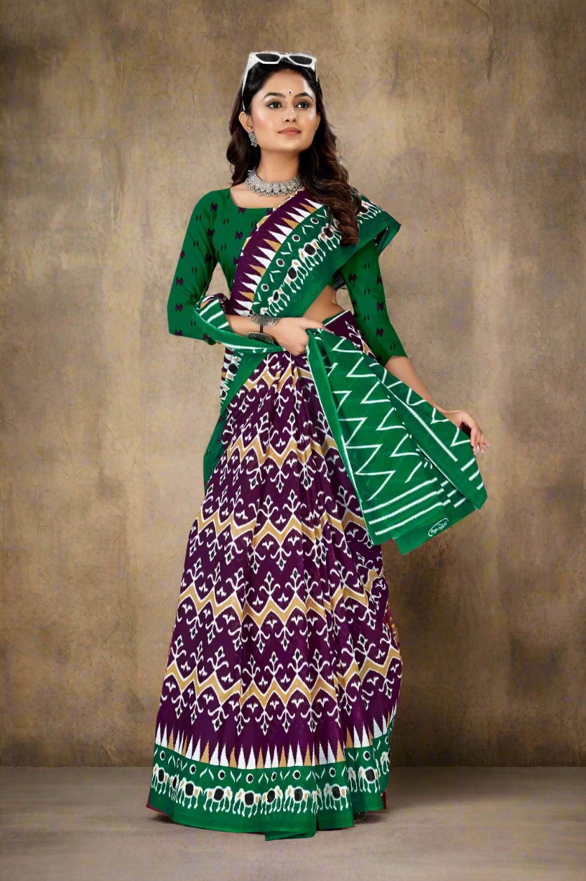 Gorgeous dark purple and green saree in cotton with batik print, perfect for elegant occasions.