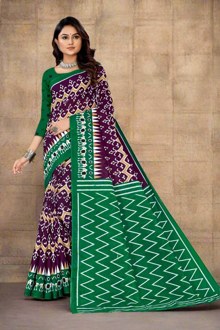 Stylish dark purple and green batik print cotton saree, perfect for events and cultural gatherings.