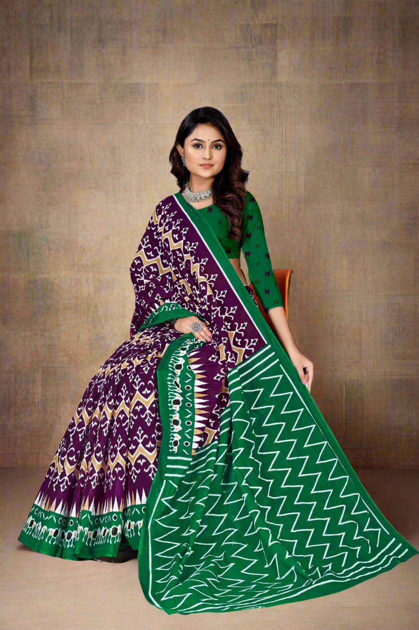 Rich dark purple and green batik print saree, a stunning choice for cultural events and festivals.