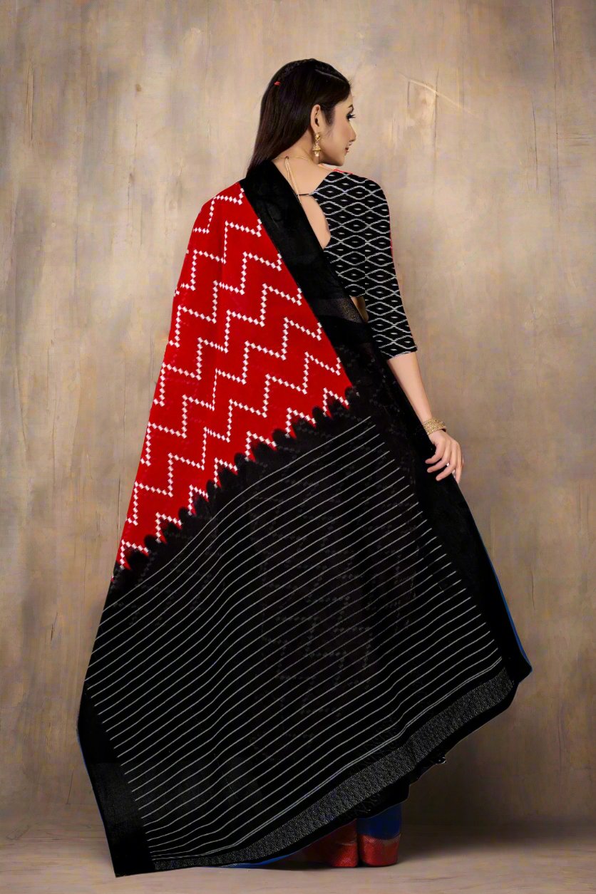 Traditional Batik cotton saree in bold red and black colors, ideal for weddings and parties.