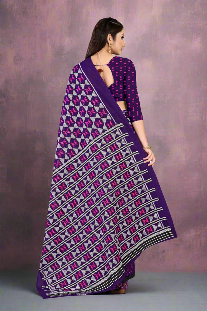 Elegant dark purple saree with batik patterns, ideal for cultural and festive occasions.