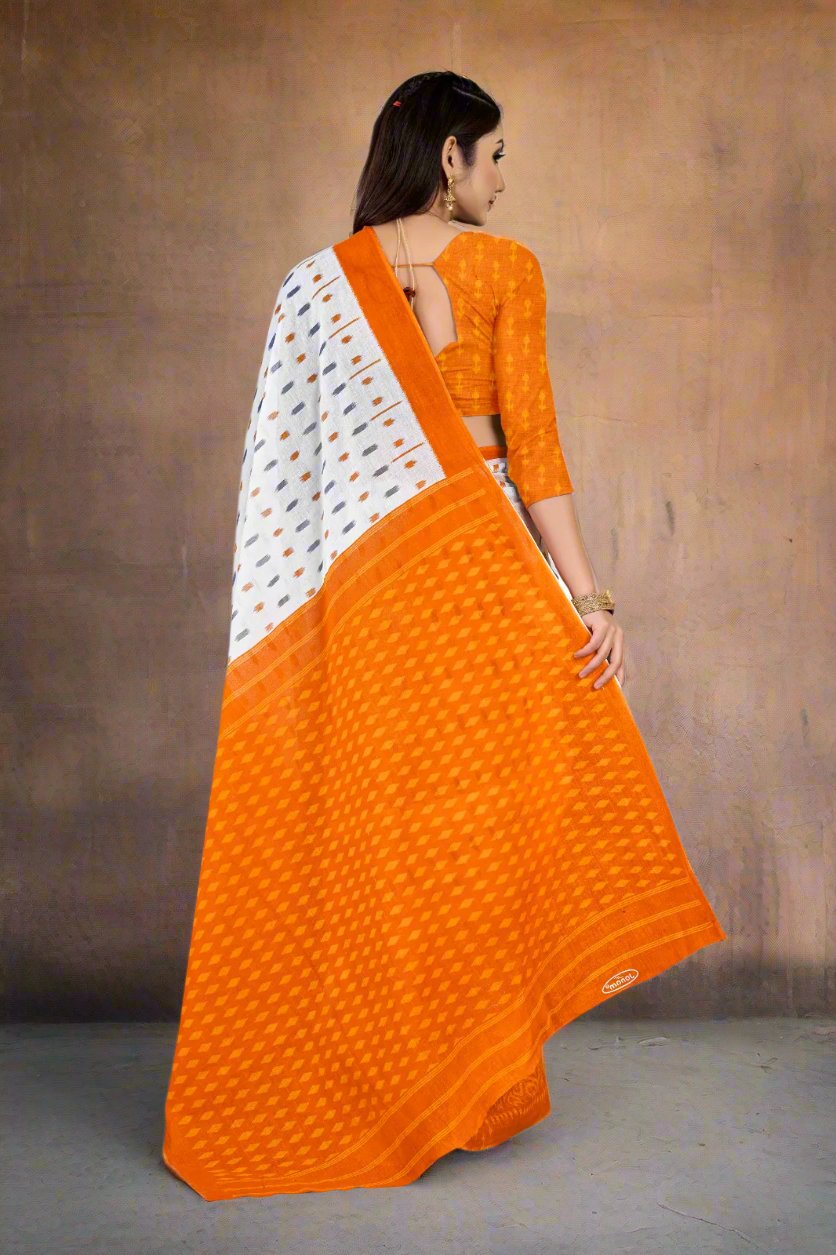 Stylish white and orange batik saree, perfect for cultural and traditional events.