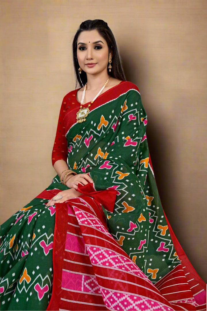 Gorgeous green and red saree, crafted from cotton, ideal for traditional wedding celebrations.