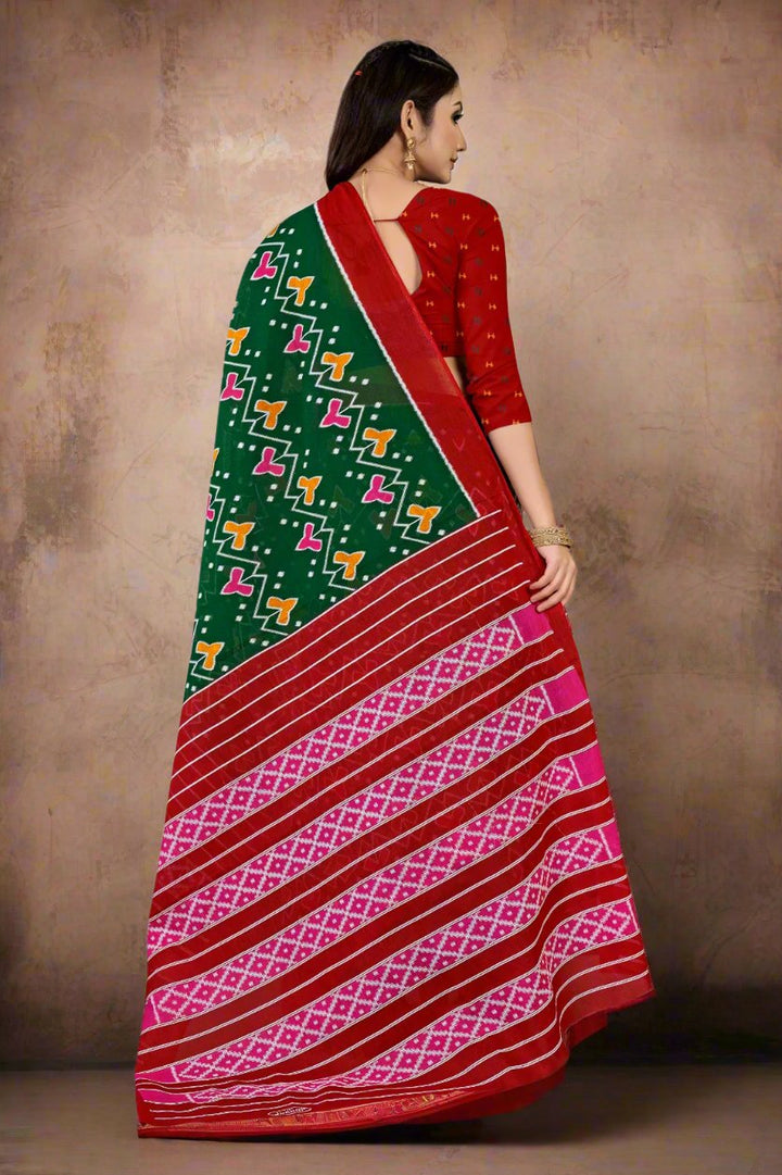 Elegant green and red batik saree with intricate designs, ideal for Indian weddings.