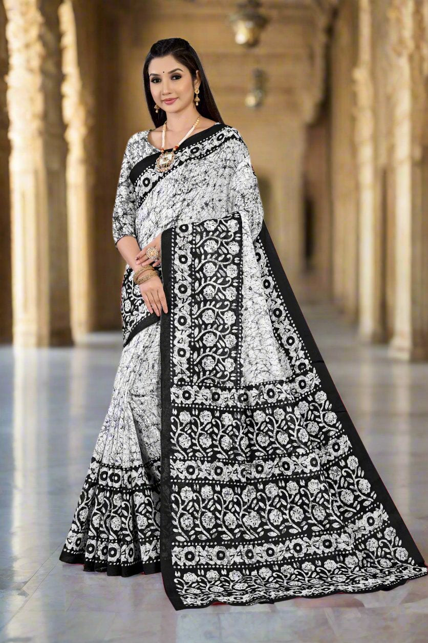 Timeless white and black batik print cotton saree, ideal for elegant Indian events.