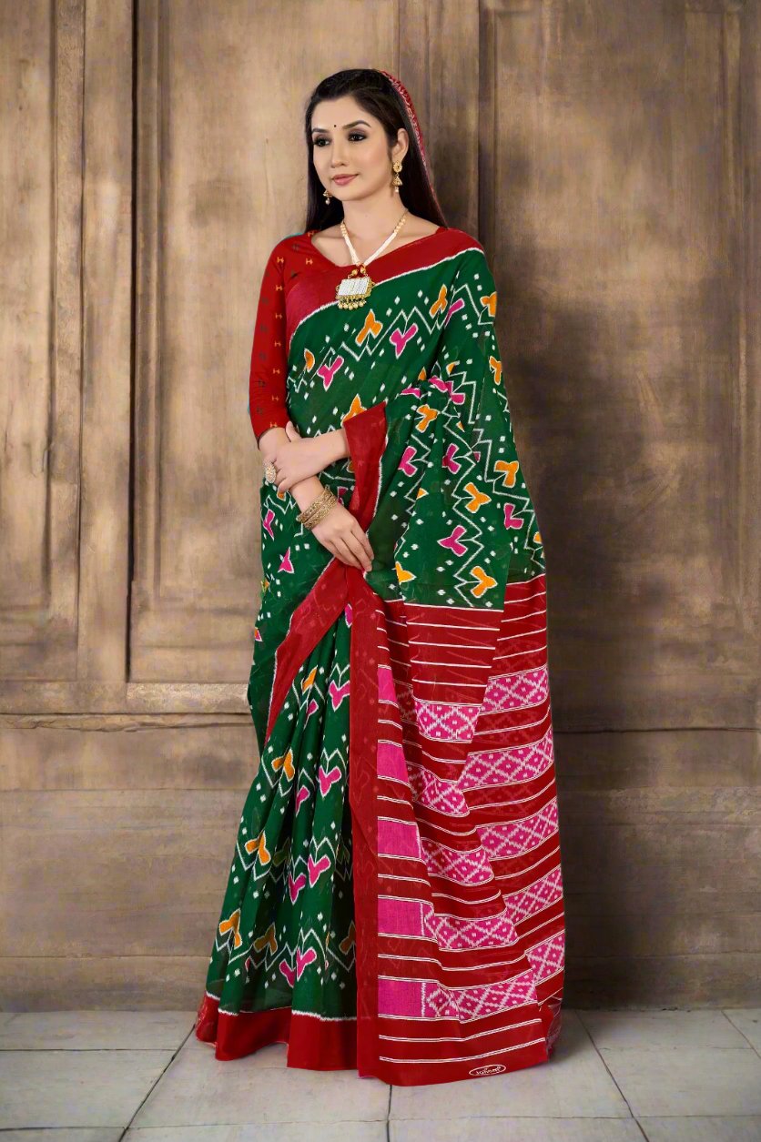 Timeless green and red batik saree, a stunning choice for Indian wedding ceremonies.