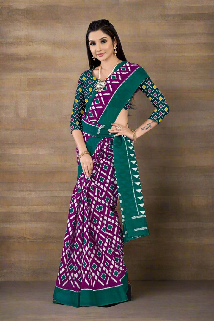 Vibrant green and purple saree with intricate batik print, perfect for Indian festivals.