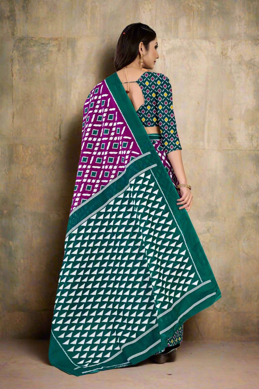 Stylish green and purple batik saree with traditional designs, ideal for weddings and events.