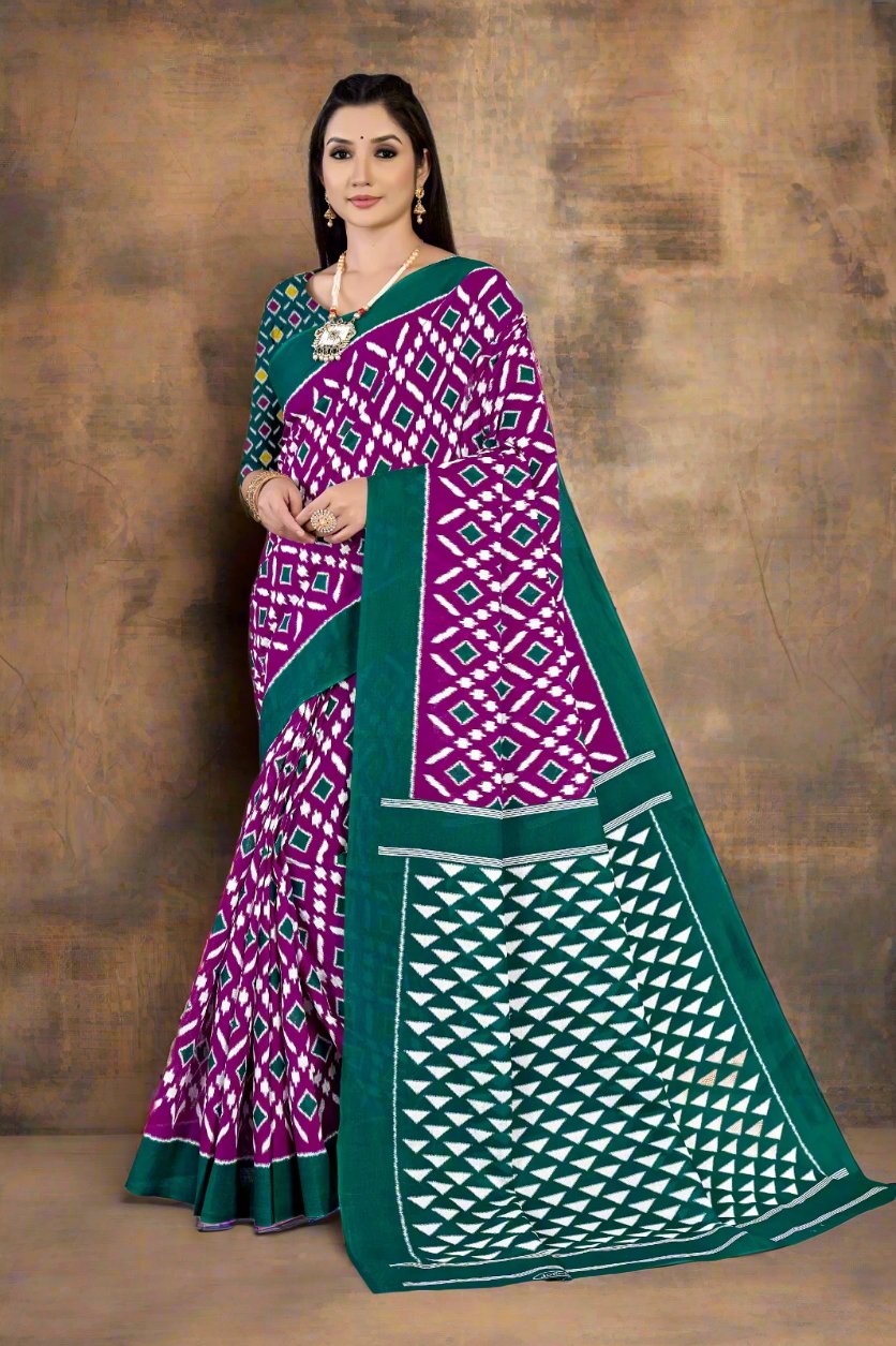 Elegant green and purple batik cotton saree, perfect for cultural and festive occasions.