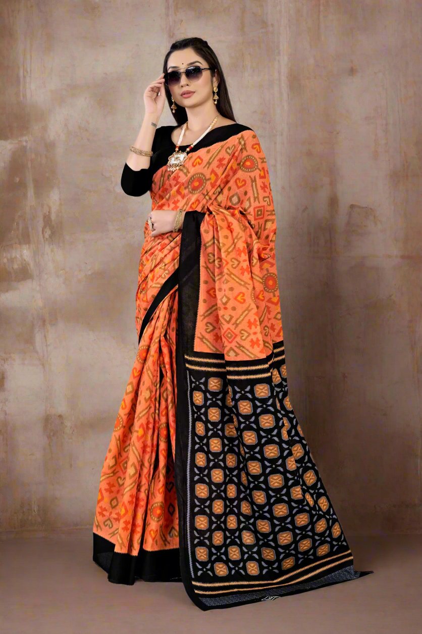 Orange and black batik print saree, perfect for unique Indian wear and festive occasions.