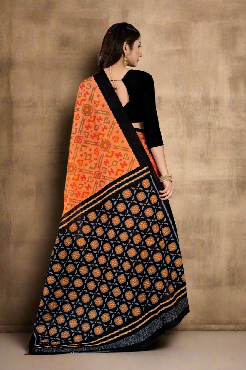 Stunning orange and black batik saree, ideal for Indian weddings and festive wear.