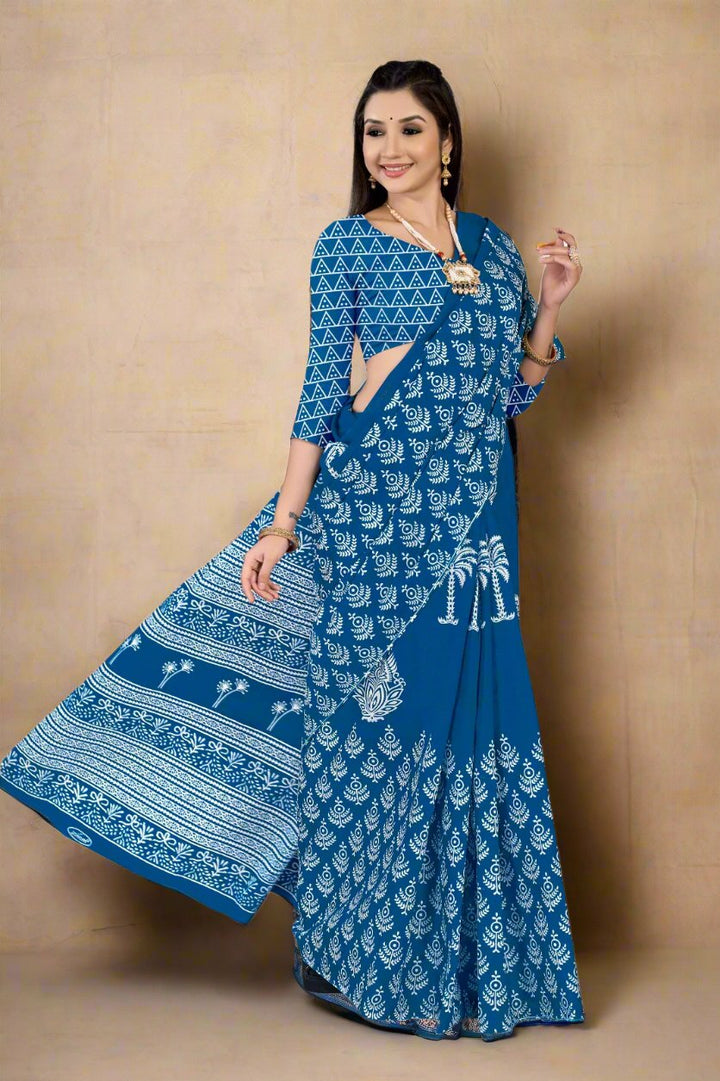 Electric blue cotton saree with batik prints, showcasing unique Indian craftsmanship for weddings.