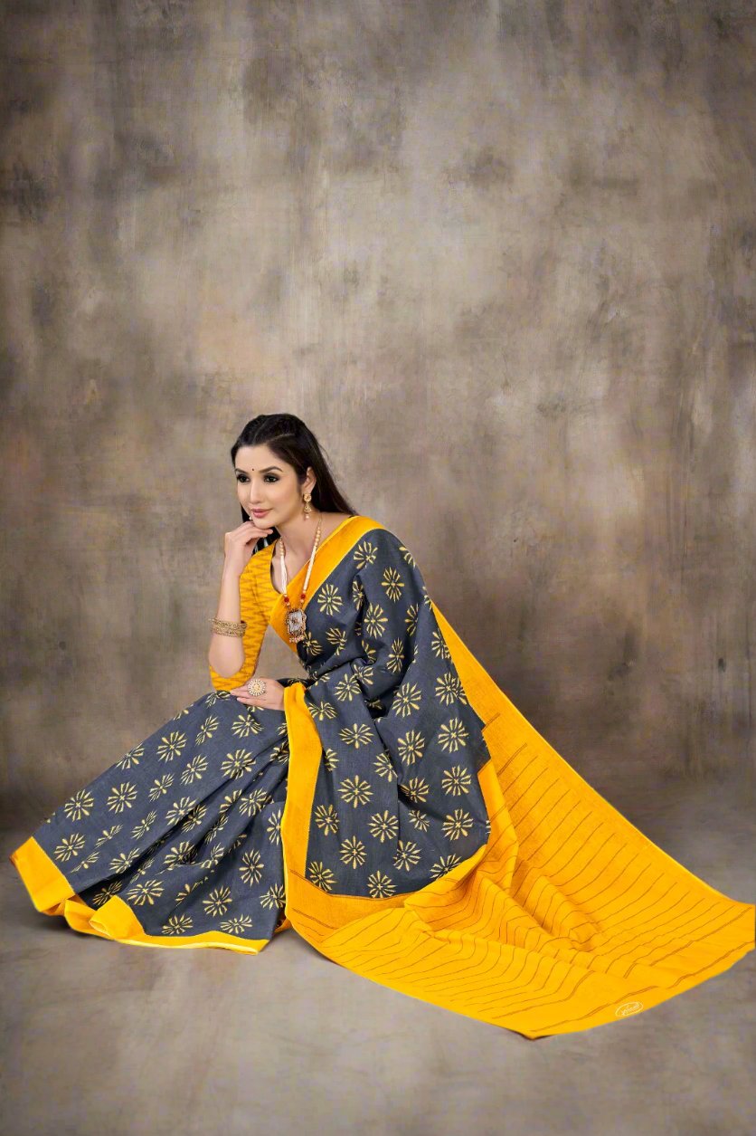 Timeless golden and gray batik saree, a sophisticated choice for cultural ceremonies.