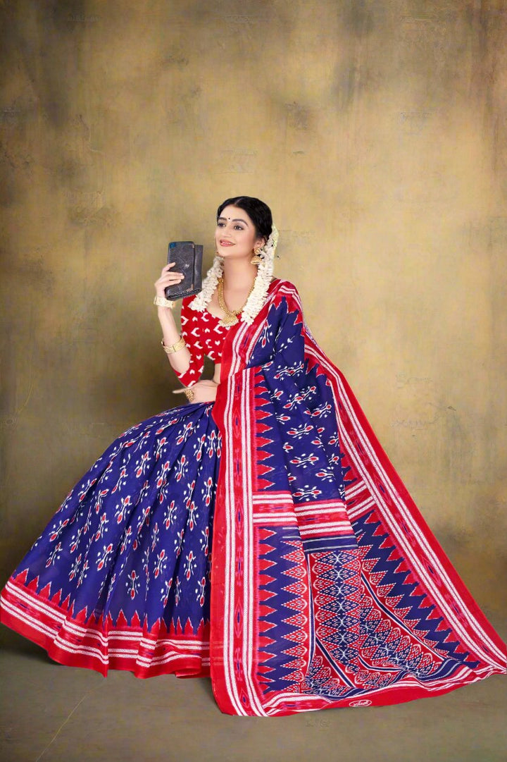 Navy blue and red batik cotton saree, a designer piece for traditional events and festive occasions.