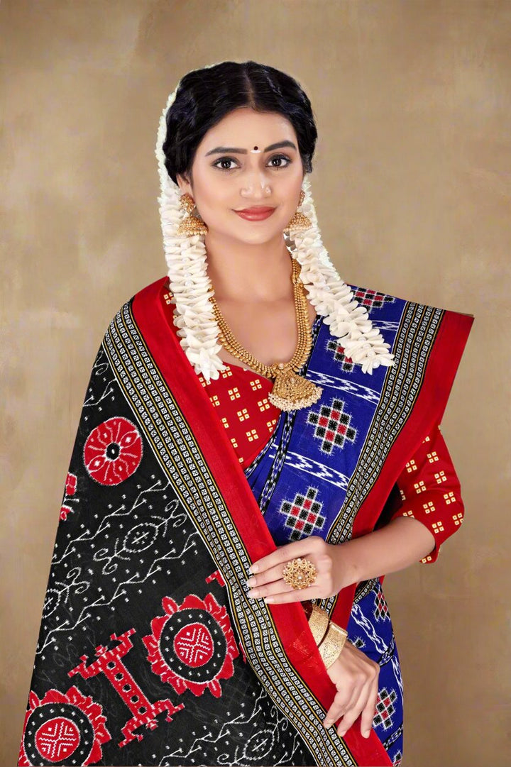 Stylish blue batik cotton saree with intricate prints, ideal for traditional wear and cultural events.