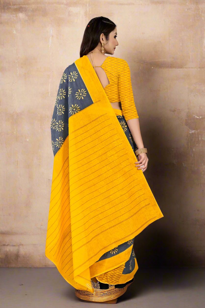 Stylish golden and gray saree with intricate batik patterns, ideal for cultural events.