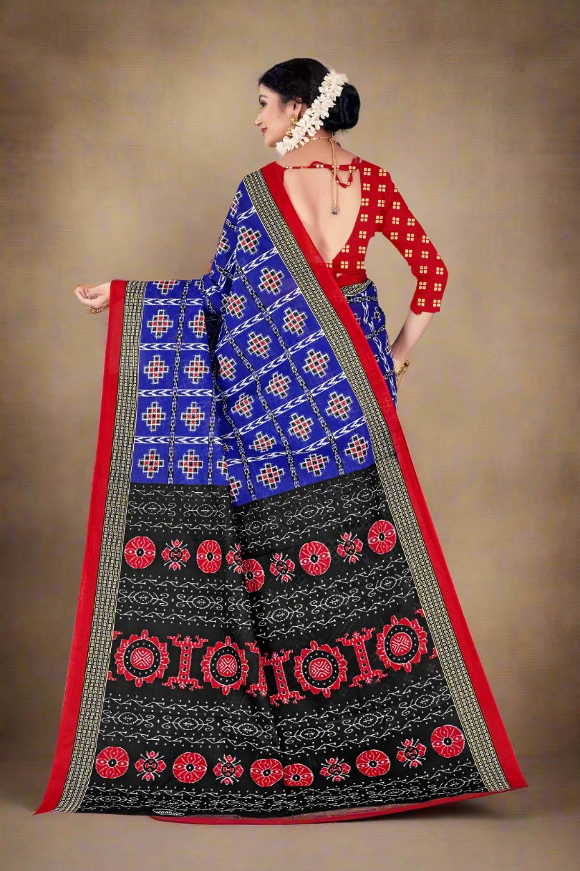 Elegant blue batik saree with traditional prints, ideal for cultural celebrations and weddings.