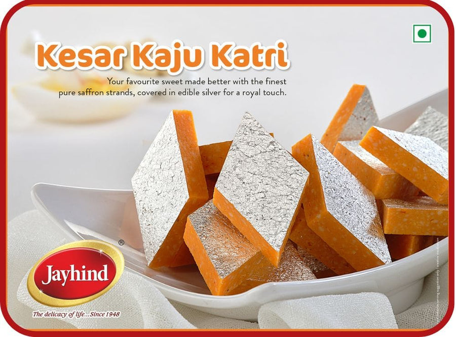 Kesar Kaju Katli made with the finest cashews and saffron, offering a luxurious, melt-in-your-mouth experience with every bite.