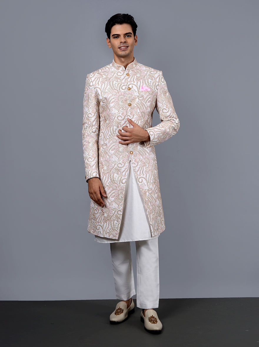 Perfect off-white and pink sherwani, combining traditional Resham and Dori work for modern grooms.