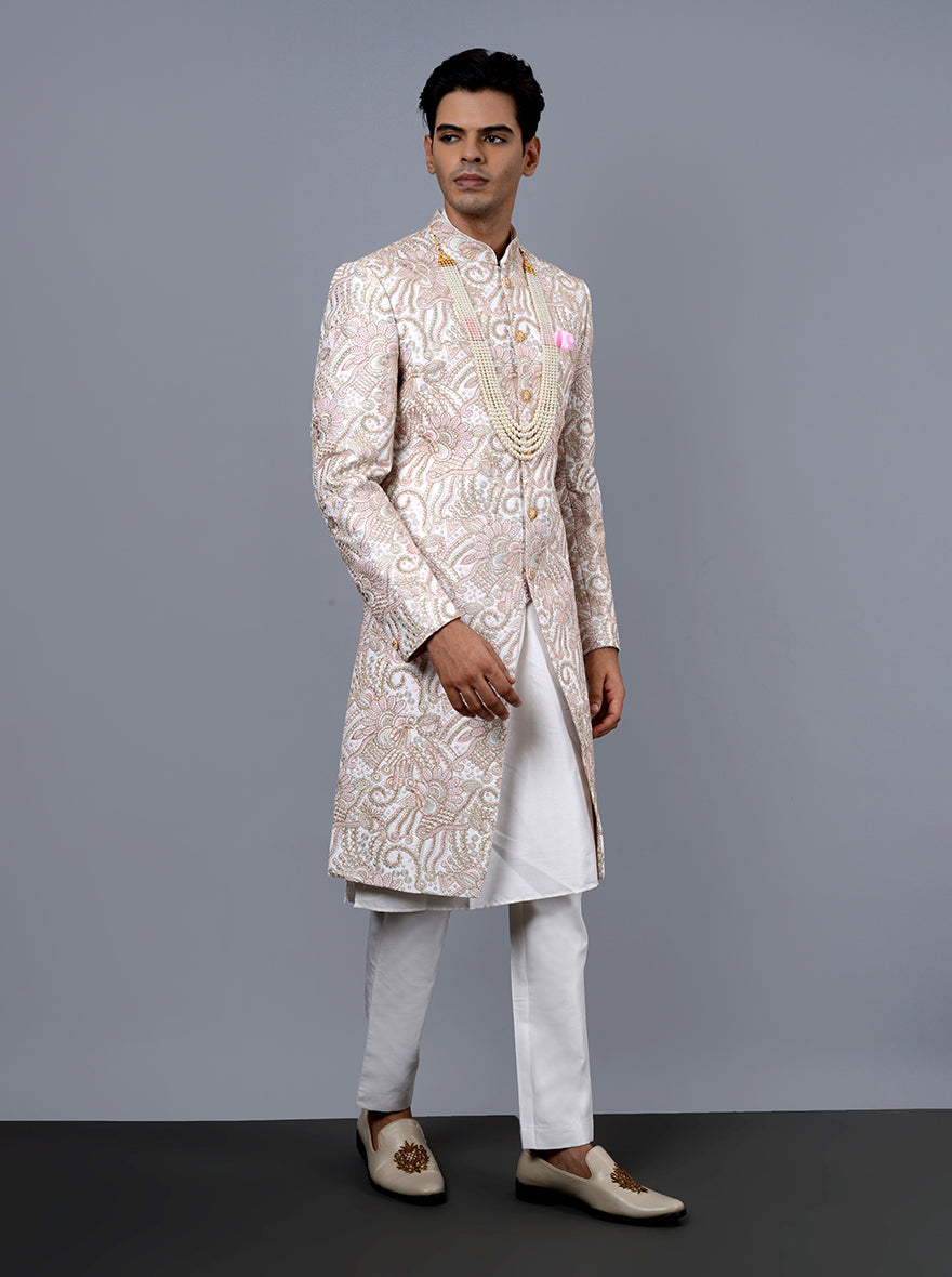 Luxurious off-white and pink sherwani with Resham and Dori details, designed for grooms in the USA.