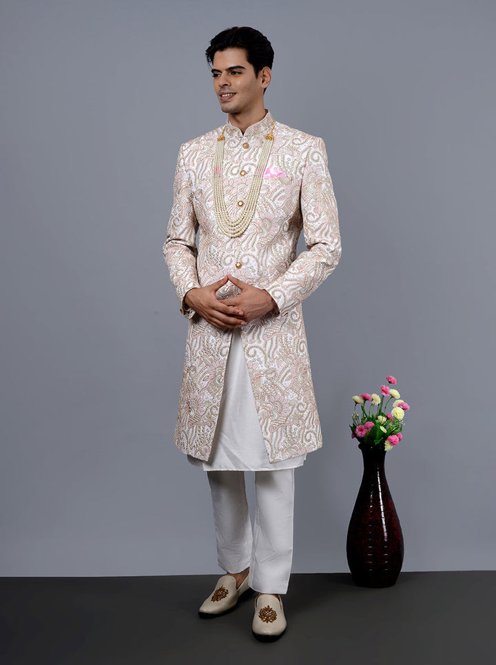 Elegant off-white and pink sherwani, ideal for making a statement at weddings and gatherings.