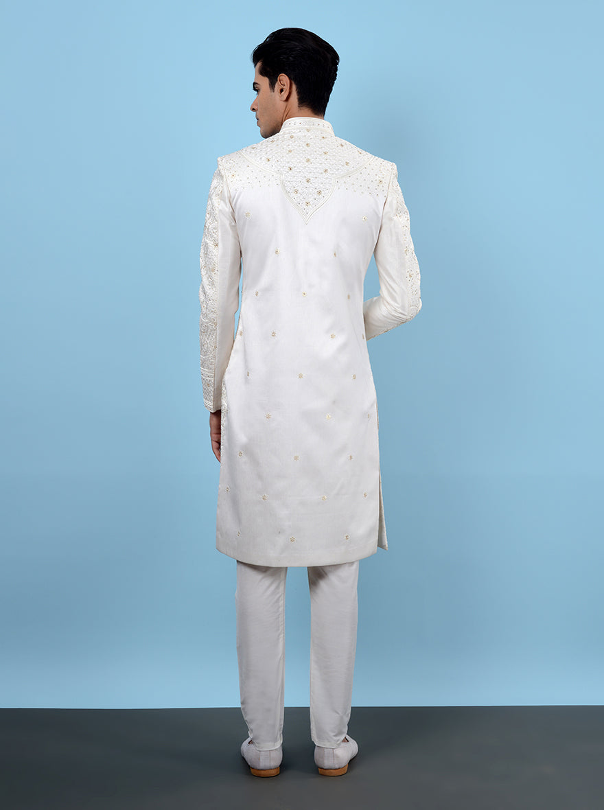 Fashionable cream sherwani designed for grooms who appreciate luxury and style.