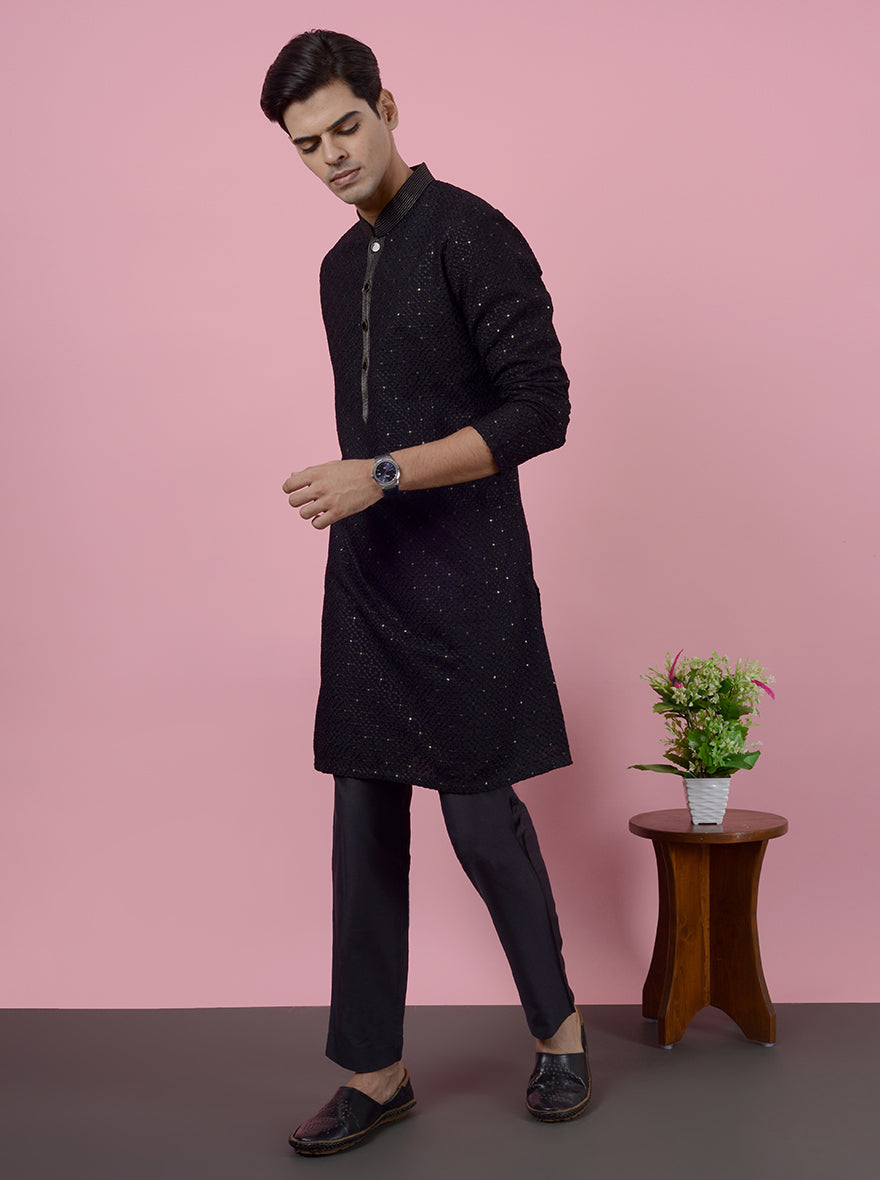 Elegant black silk kurta pajama for USA Sufi night, with intricate embroidery.