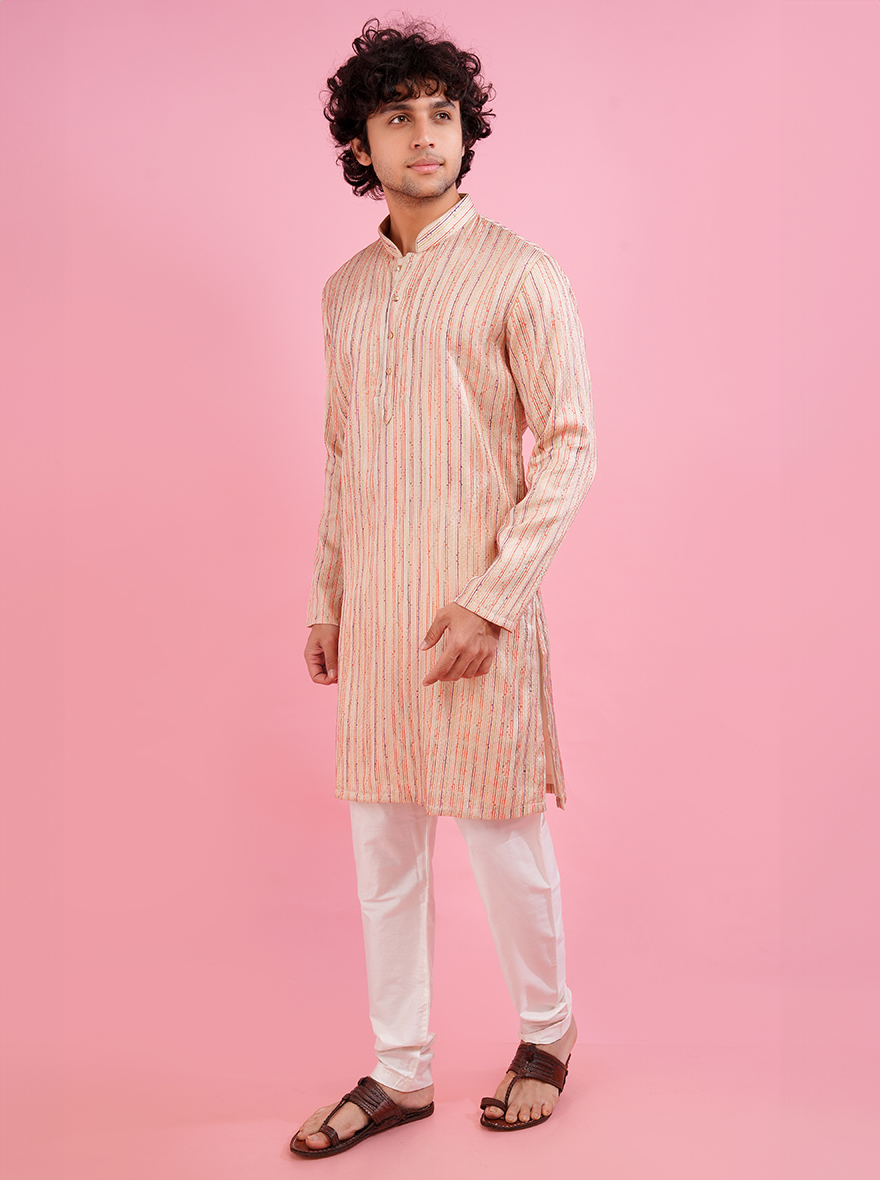 Fashionable cream kurta set, perfect for festive celebrations.