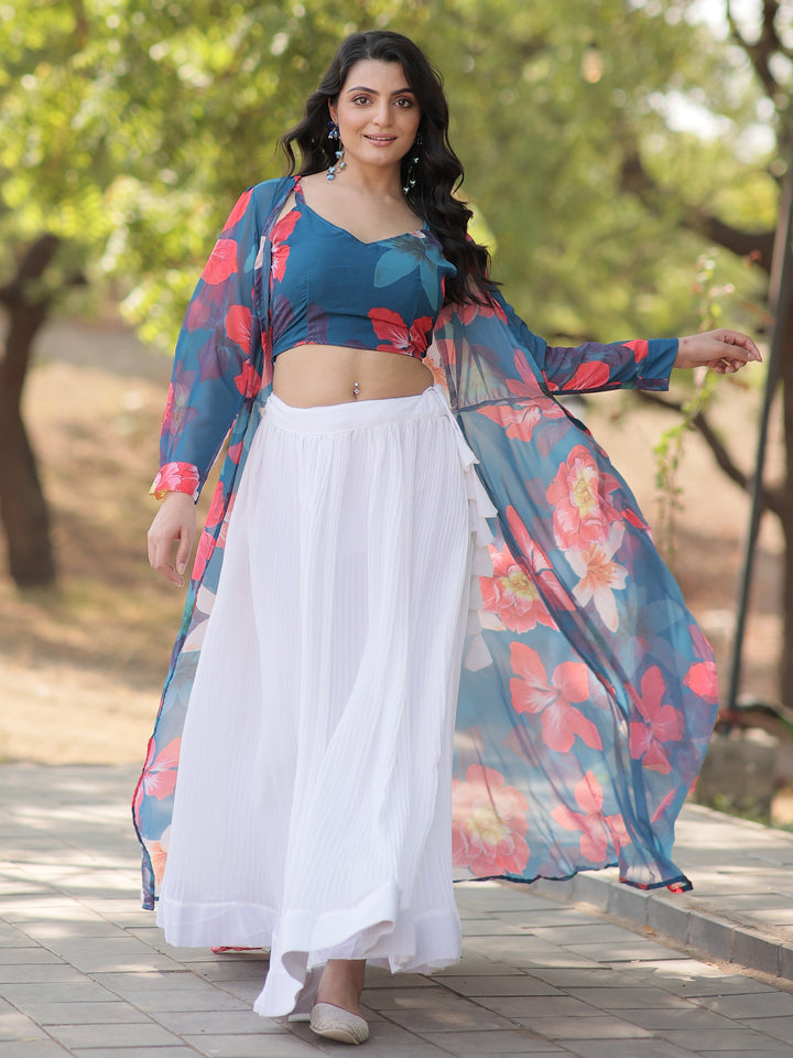 Make a graceful statement with this beautiful white georgette crush lehenga. Fully stitched and available in size L, the lehenga features a classic white fabric with a sophisticated textured finish.  The look is elevated by a sky-blue georgette crop top adorned with vibrant floral prints, adding a fresh and contemporary touch. Completing the ensemble is a sky-blue georgette jacket, also detailed with floral prints, which adds an extra layer of elegance.  Perfect for festivals, parties, or casual gatherings,