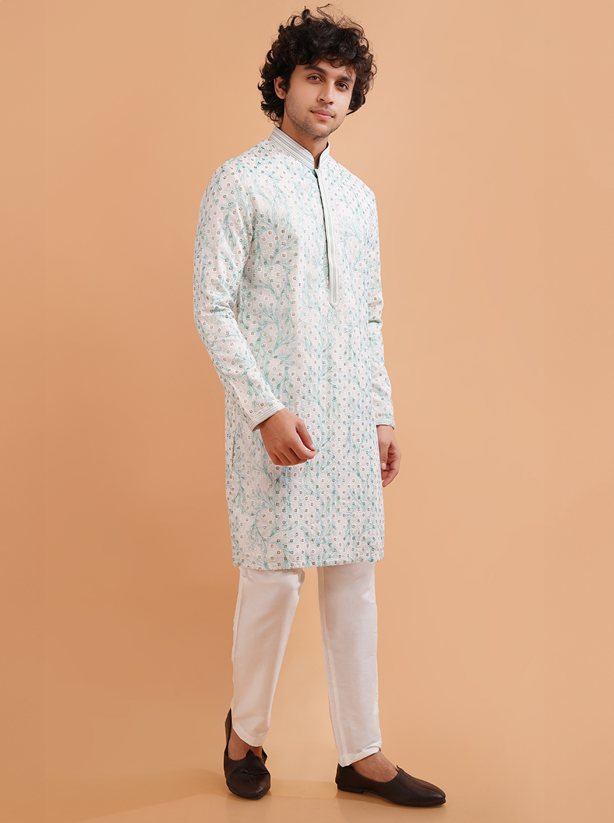 Shine at celebrations in the USA with this white silk kurta pajama featuring beautiful embroidery.