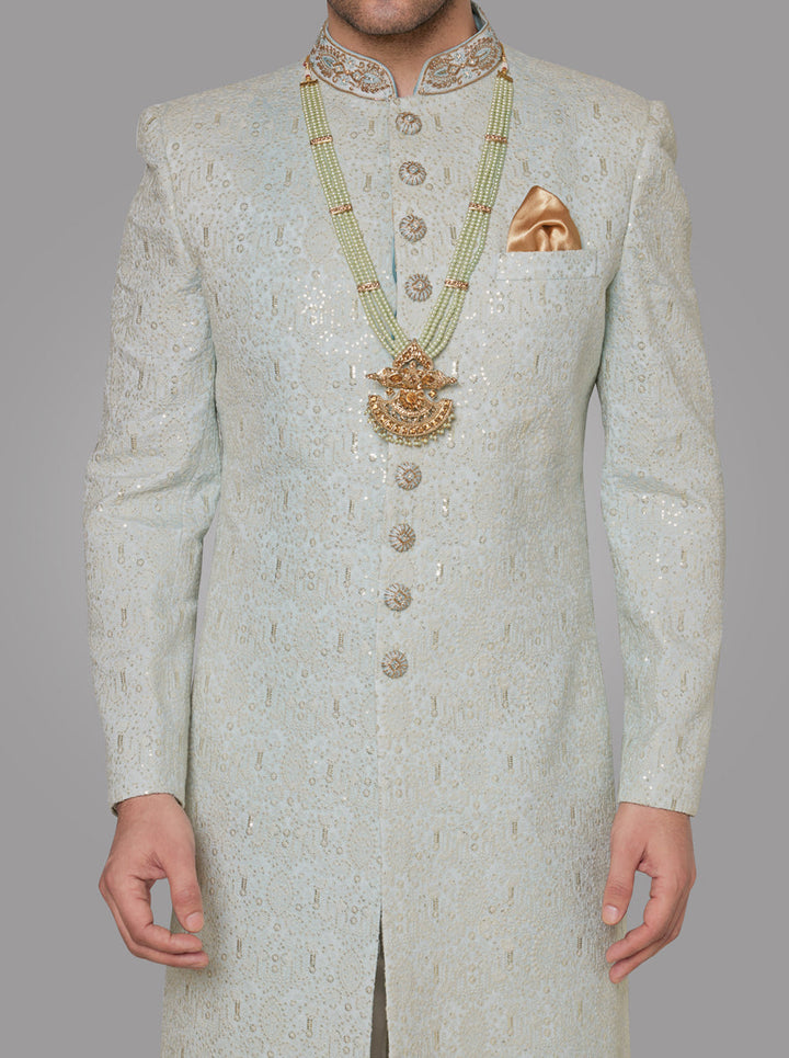 Perfect for grooms, this luxurious Mint Green Sherwani combines intricate detailing with premium fabric.