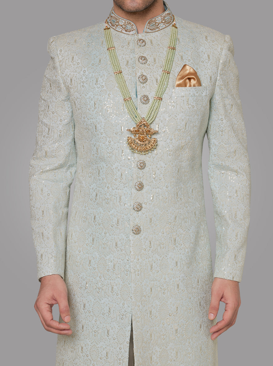 Perfect for grooms, this luxurious Mint Green Sherwani combines intricate detailing with premium fabric.