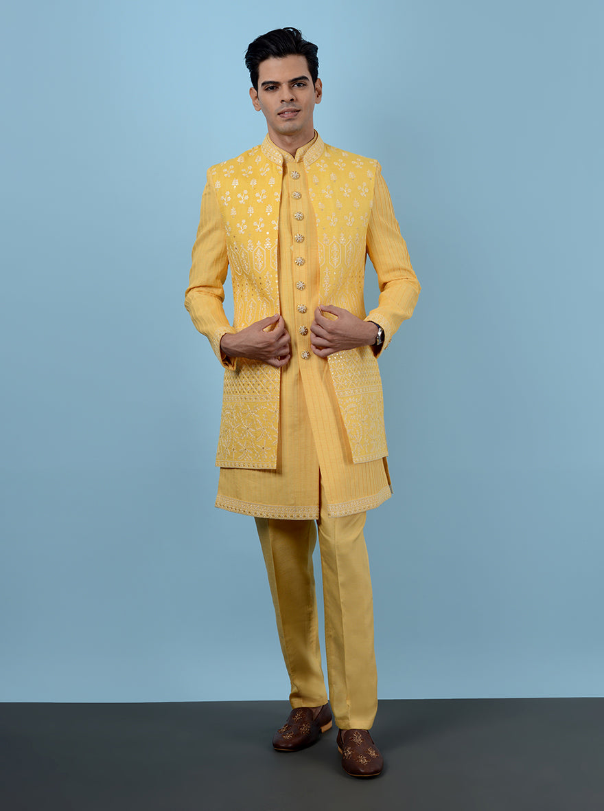 Celebrate your Haldi event in this stunning yellow Indowestern, crafted from premium silk blend and adorned with lovely embroidery, making it a perfect choice for festive occasions in the USA.