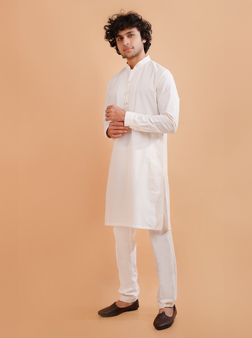 Discover the versatility of this white cotton kurta set, designed for style and ease at family events.