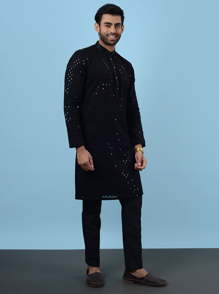 Celebrate in sophistication with our black embroidered kurta pajama, designed for modern men.