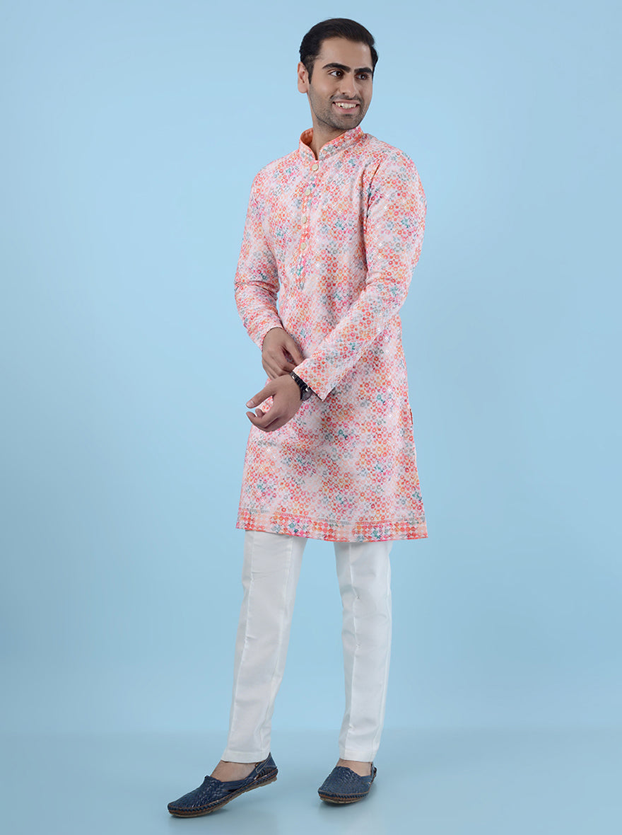 Elegant pink kurta pajama set for men, crafted from silk blend with intricate embroidery for cultural events.