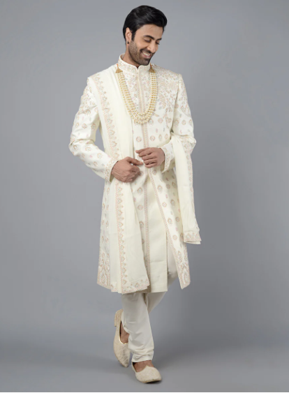 This cream sherwani combines Resham and beadwork, offering a blend of traditional and contemporary design.