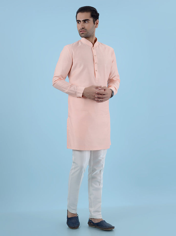 Peach silk blend kurta set for men, designed with a regular fit for cultural and festive events.