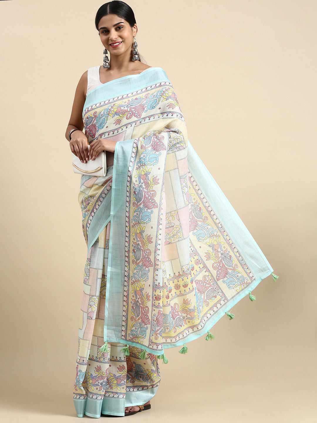 Soft pure linen saree featuring classic floral print and zari-lined border