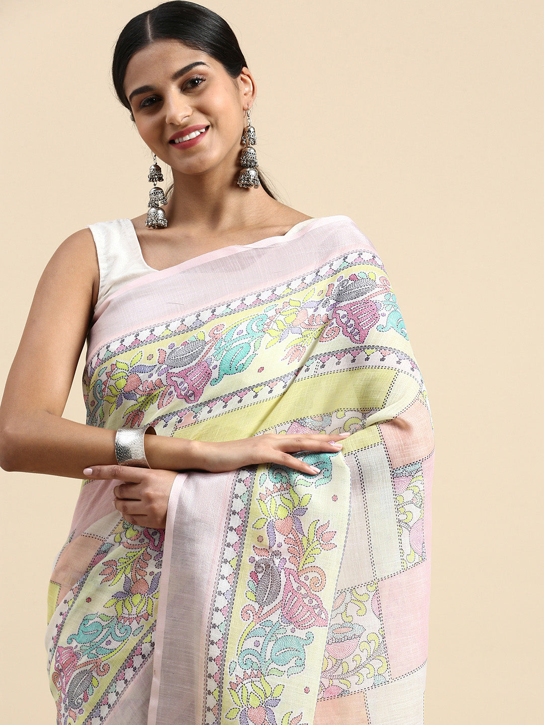 Classic floral linen saree with a zari-lined Kantha lotus border