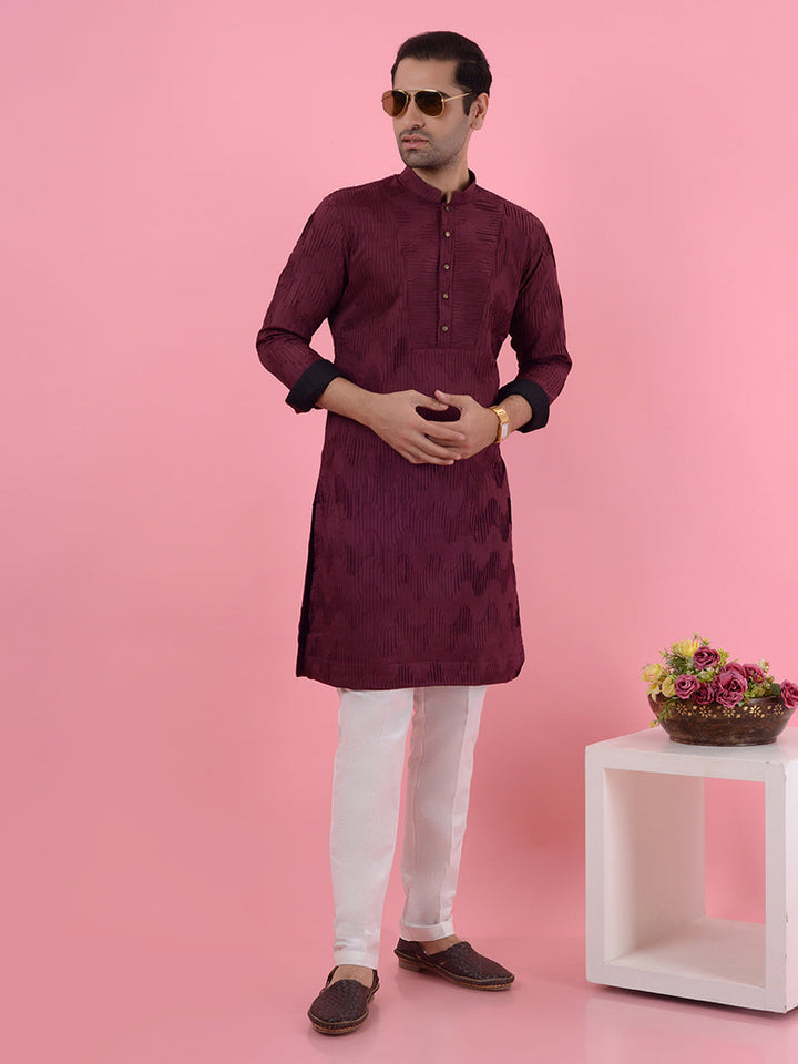 Celebrate pre-wedding festivities in style with this luxurious wine kurta pajama set for men.