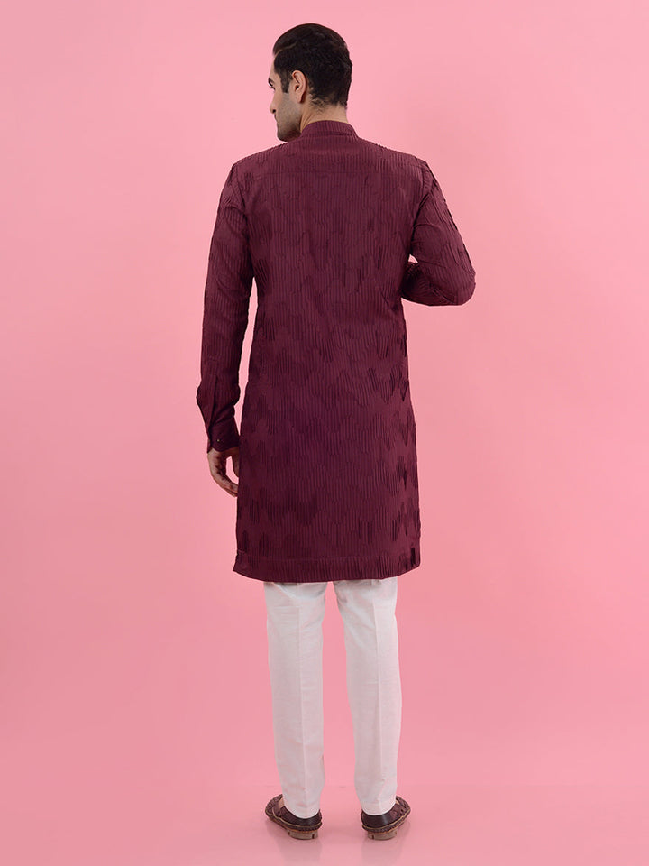 This wine kurta pajama set offers a stylish choice for men, ensuring you stand out on special occasions.