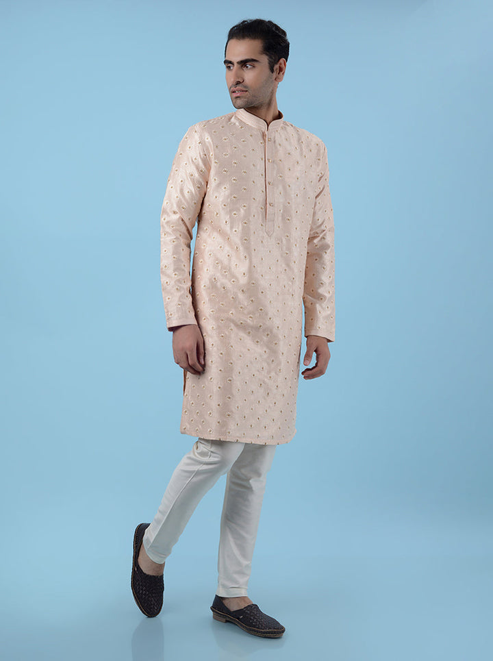 Traditional peach silk blend kurta pajama for men, designed for festive and cultural events.