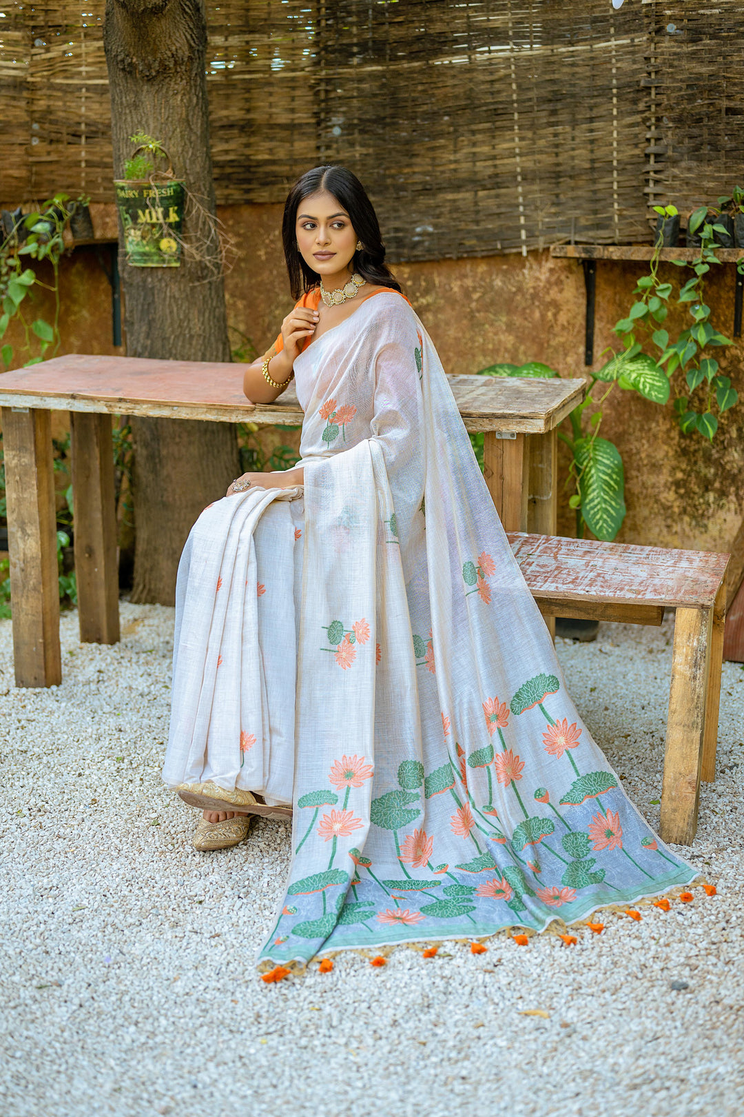 Beautiful Muga silk saree with intricate floral weave and tassels on pallu