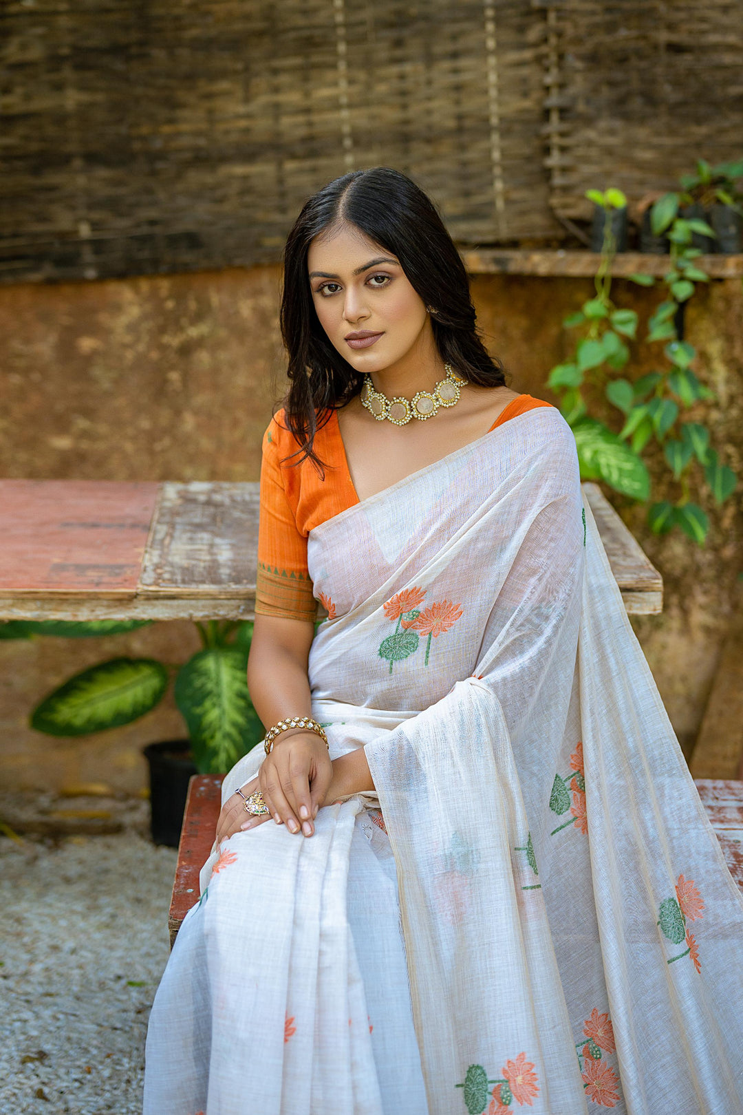 Muga silk saree with floral weaving pattern and Pichwai-style pallu