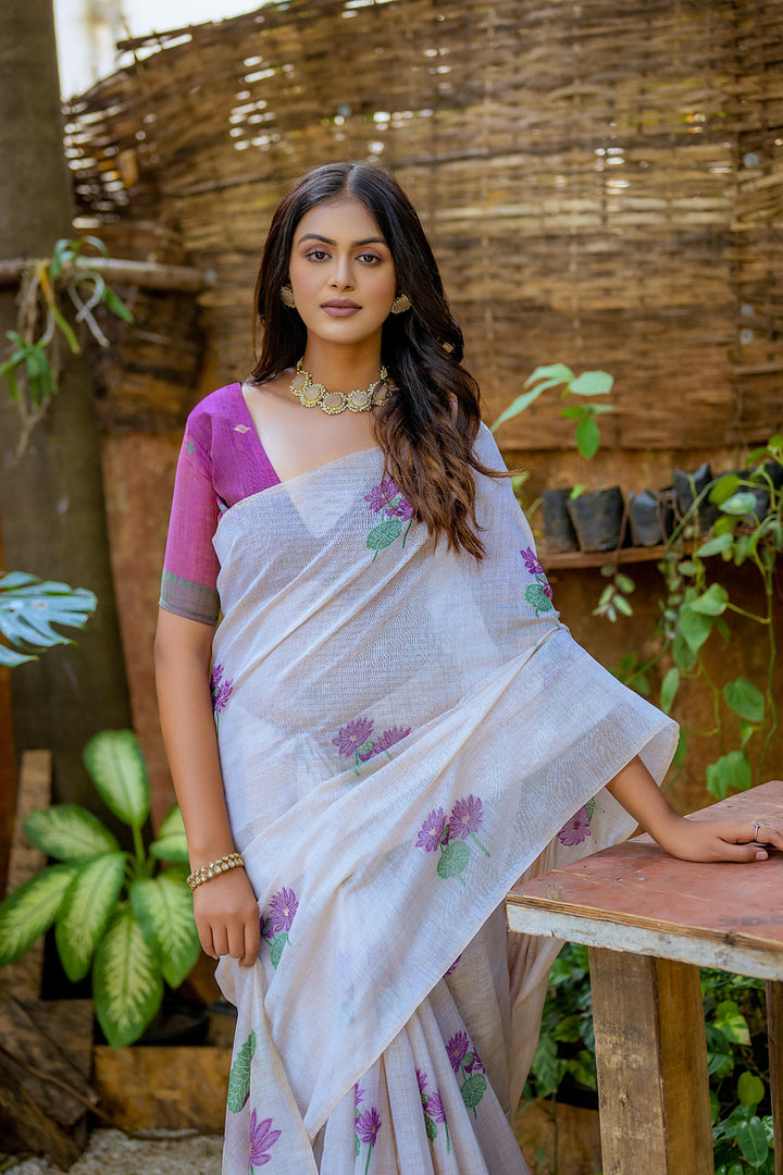 Muga silk saree with detailed floral weaving and stylish tassels for events