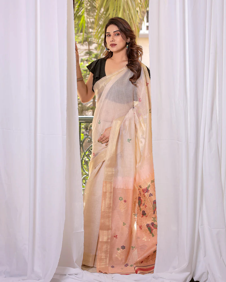 Elegant peach Muga cotton saree with refined zari border, bringing a luxurious touch to traditional wear.