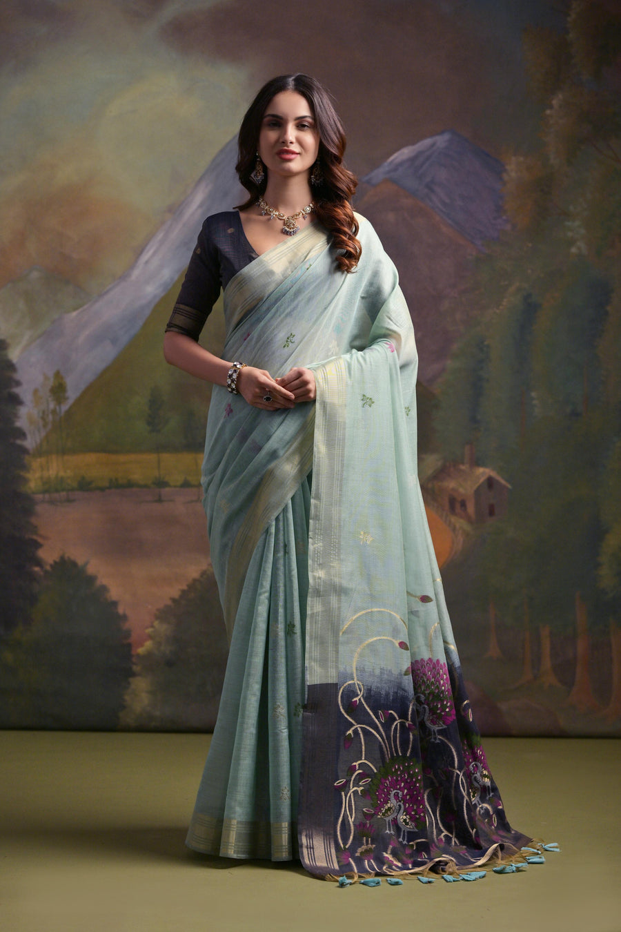 Sea green Muga silk saree with intricate Resham work, perfect for traditional Indian celebrations.